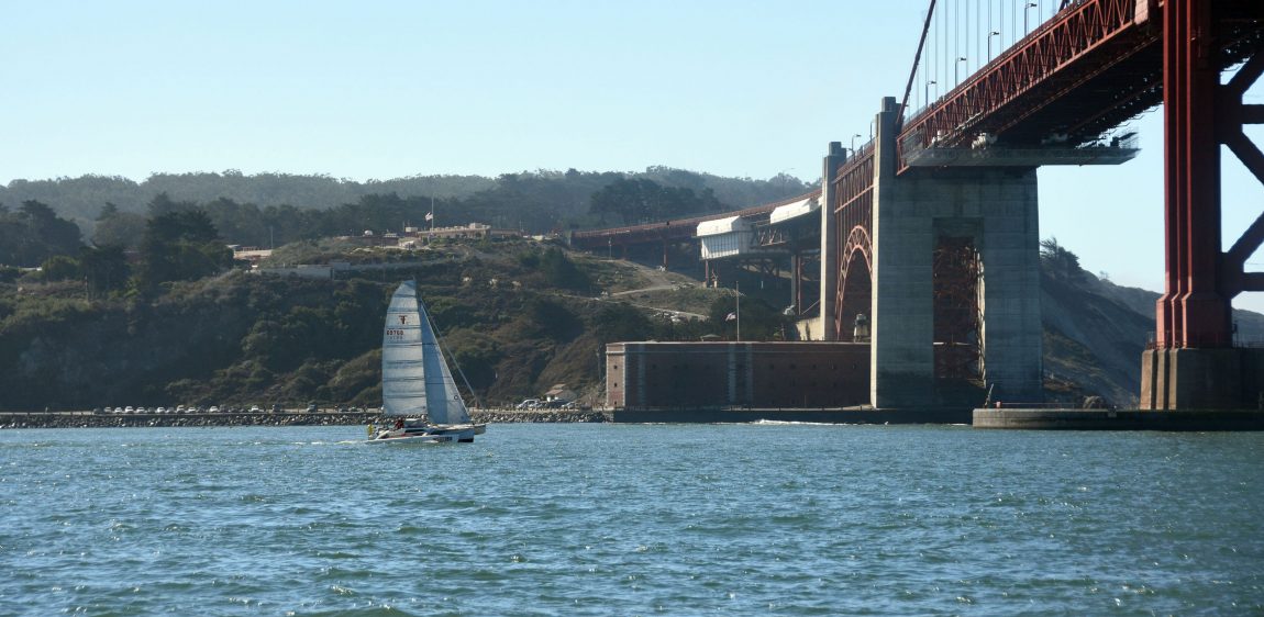 Trimaran sails toward Golden Gate Bridge